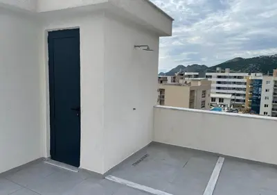 a blue door on the side of a building at Apartment SuSe in Dobra Voda