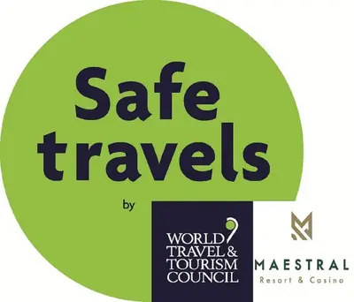 a green sign with the words safe travels on it at Maestral Resort & Casino in Budva