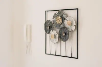 a framed picture of flowers on a wall at Seafront Villa with Private Pool in Dobra Voda, Montenegro in Bar