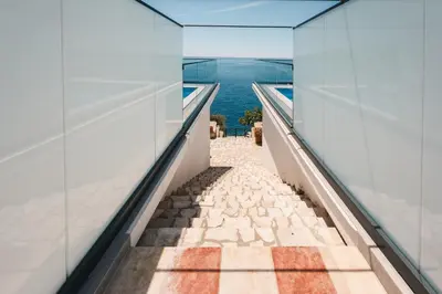 a view of the ocean from a building hallway at Seafront Villa with Private Pool in Dobra Voda, Montenegro in Bar