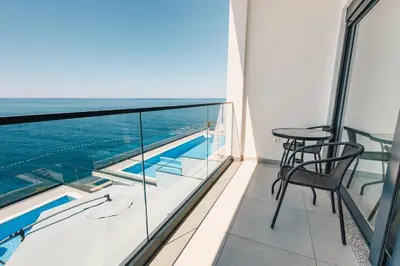 a balcony with a view of the ocean at Seafront Villa with Private Pool in Dobra Voda, Montenegro in Bar