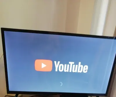 a computer monitor with the word youtube on the screen at One minute to the beach in Becici