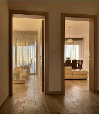 a hallway with a living room and a living room with a couch at Paradise beachfront view 2 in Dobra Voda