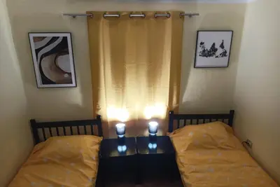 two beds in a room with two candles on them at Holiday in the National park Lovcen in Cetinje