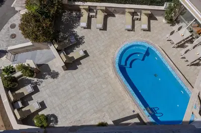 an overhead view of a swimming pool in a resort at Apartments Del Mar in Petrovac na Moru