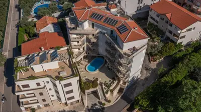 an overhead view of a building with a pool at Apartments Del Mar in Petrovac na Moru