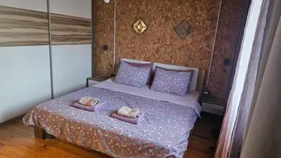 a bedroom with a bed with two pillows on it at Lola - Ada Bojana River House in Ulcinj
