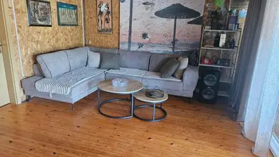 a living room with a couch and two tables at Lola - Ada Bojana River House in Ulcinj