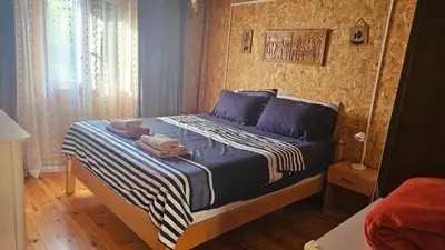 a bedroom with a bed with towels on it at Lola - Ada Bojana River House in Ulcinj