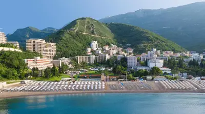 an aerial view of a city with a mountain at Iberostar Waves Bellevue All Inclusive in Budva