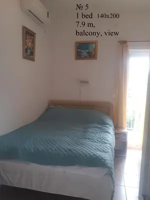 a bedroom with a bed in a room at OLGA apartmani in Sutomore