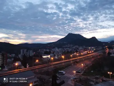 a view of a city at night with street lights at OLGA apartmani in Sutomore