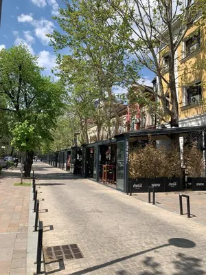 a cobblestone street in front of a store at Stan u strogom centru grada in Podgorica