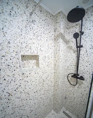 a bathroom with a shower with a shower head at Marco Polo in Petrovac na Moru