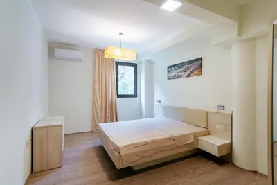 a bedroom with a bed in a room with a window at Budva Gate in Budva