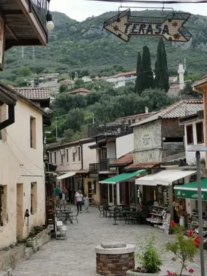 a street in a town with tables and buildings at Old Town - Guest House in Stari Bar