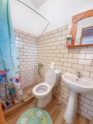 a bathroom with a toilet and a sink at RAINBOW HOME in Gornji Štoj