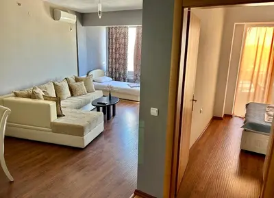 a living room with a couch and a table at Romantica Apartments in Ulcinj