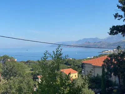 a view of a body of water with mountains at Guest House in Utjeha in Utjeha