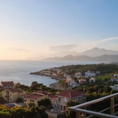 a view of a town and the ocean at Cold Bay Mansion Luxury Sea View Suites in Bar