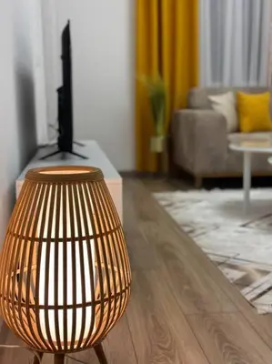 a living room with a chair and a table at Swiss Apartments 2 in Ulcinj