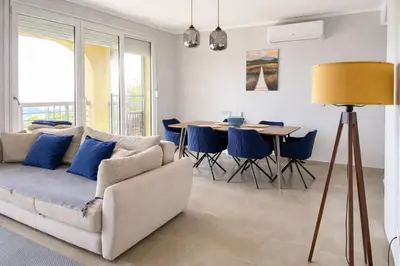 a living room with a couch and a table at Golden Horizon Villas in Budva