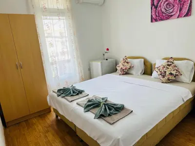a bedroom with a bed with bows on it at BOGUMILA in Bar