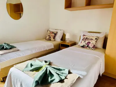 a room with two beds with bows on them at BOGUMILA in Bar