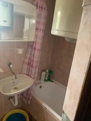 a bathroom with a sink and a bath tub and a sink at NIKOLA studio in Podgorica