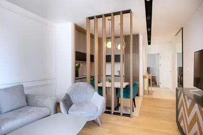a living room with a couch and a table at Adriatic Dream Apartment Becici in Budva