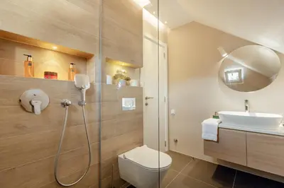 a bathroom with a shower and a toilet and a sink at Kotor Central Point in Kotor