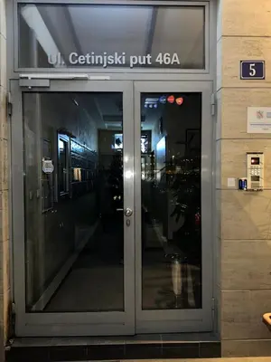 an entrance to a building with a glass door at Thousand Roses in Podgorica