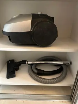 a toaster sitting on a shelf with a hose at Thousand Roses in Podgorica