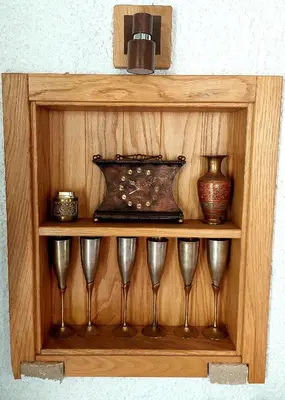 a wooden shelf with wine glasses and a vase on it at Vinogradina Eco Vukčević in Virpazar