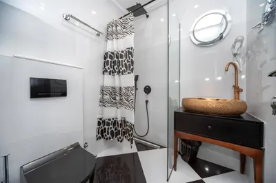 a bathroom with a sink and a shower at Baba's Hotel & Spa in Dobra Voda