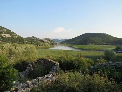 a view of a river with mountains in the background at Feel the Karuch in Cetinje