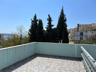 a balcony with a white fence and trees at Green Villa in Bar, Susanj