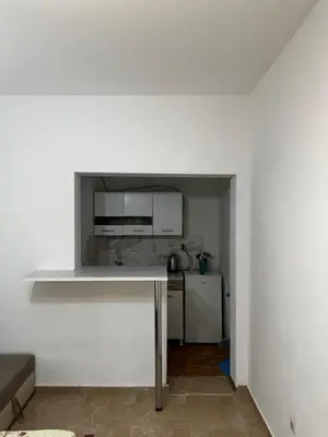 a kitchen with a white counter and a refrigerator at Green Villa in Bar, Susanj