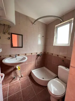 a bathroom with a toilet and a sink and a tub at Green Villa in Bar, Susanj