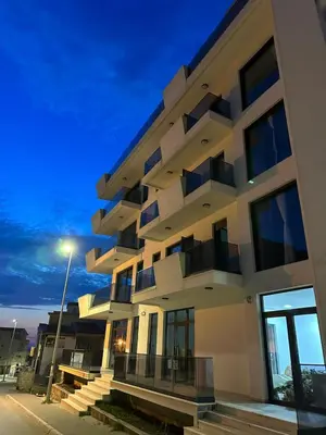a building with a street light in front of it at French Mood in Dobra Voda