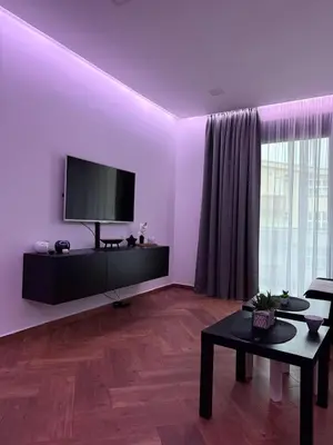 a living room with a flat screen tv on a wall at French Mood in Dobra Voda