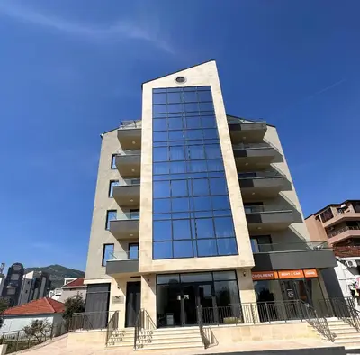 a tall building with a lot of windows at Мamma Mia Аpartments in Budva