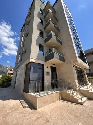a building with balconies on the side of it at Мamma Mia Аpartments in Budva