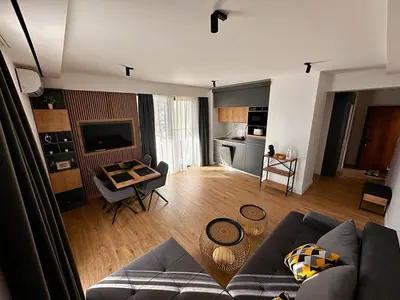 a living room with a couch and a table at Мamma Mia Аpartments in Budva