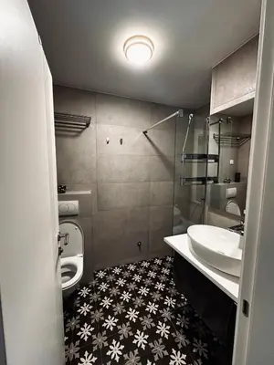 a bathroom with a sink and a toilet at Мamma Mia Аpartments in Budva